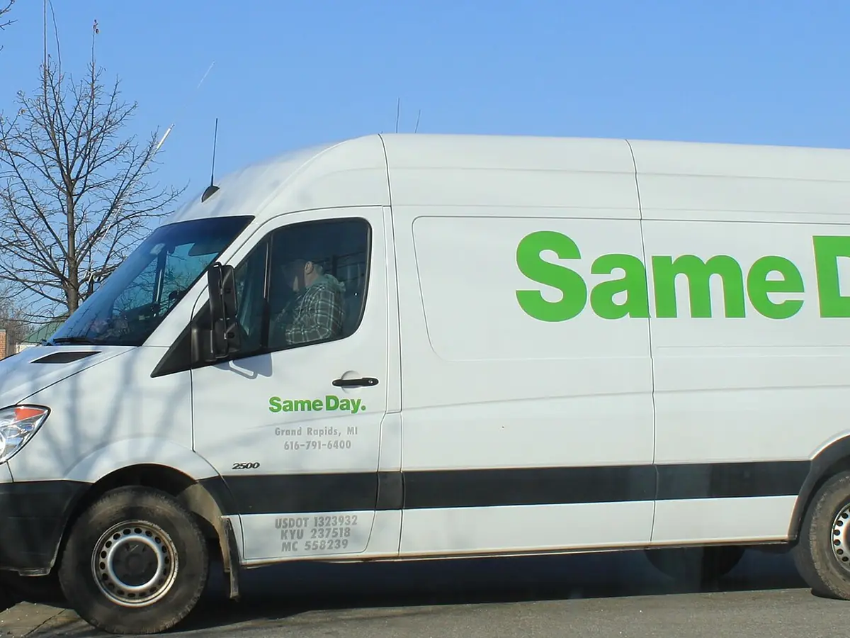 A white parcel delivery van in service